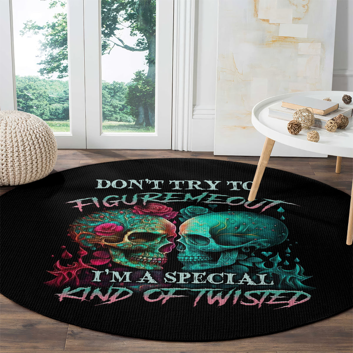 Black round skull graphic rug with teal and red skulls and pink “Don’t try to figure me out” text