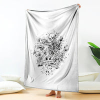 White throw blanket with centered black skeleton emblem and banner-style game text
