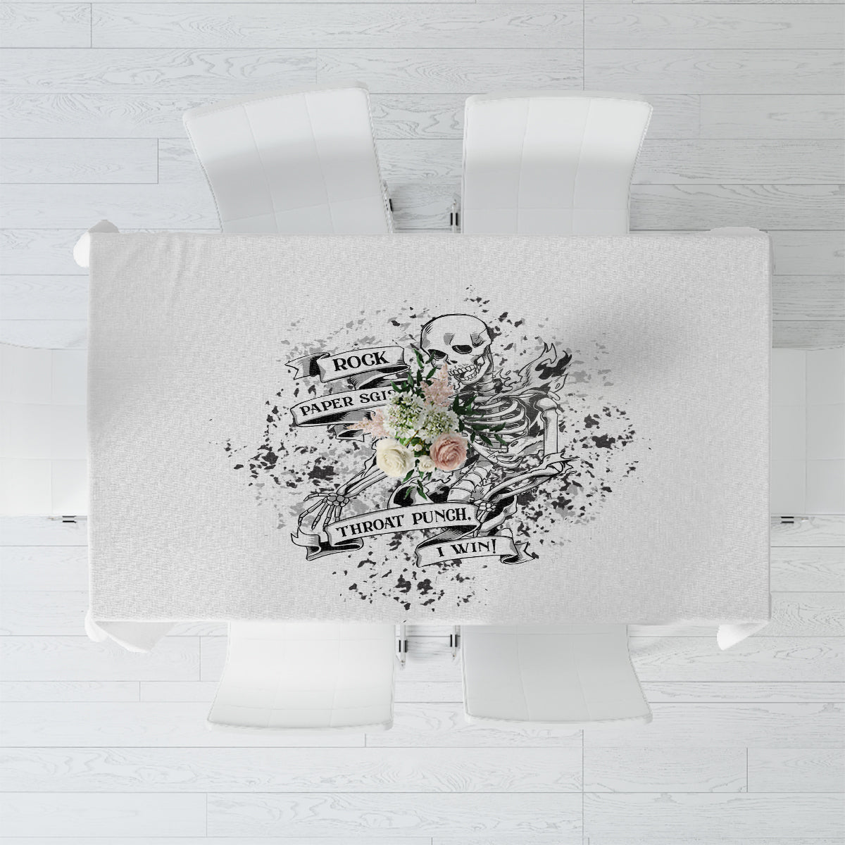 Black-and-white tablecloth with centered skull-themed game graphic design, top view