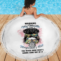 Round white beach blanket featuring multicolor warning magician graphic and tassel fringe border