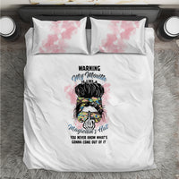 White duvet bedding set with two pink watercolor pillow shams and central illustrated graphic