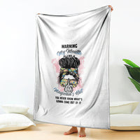 White blanket draped display, featuring colorful warning quote portrait graphic
