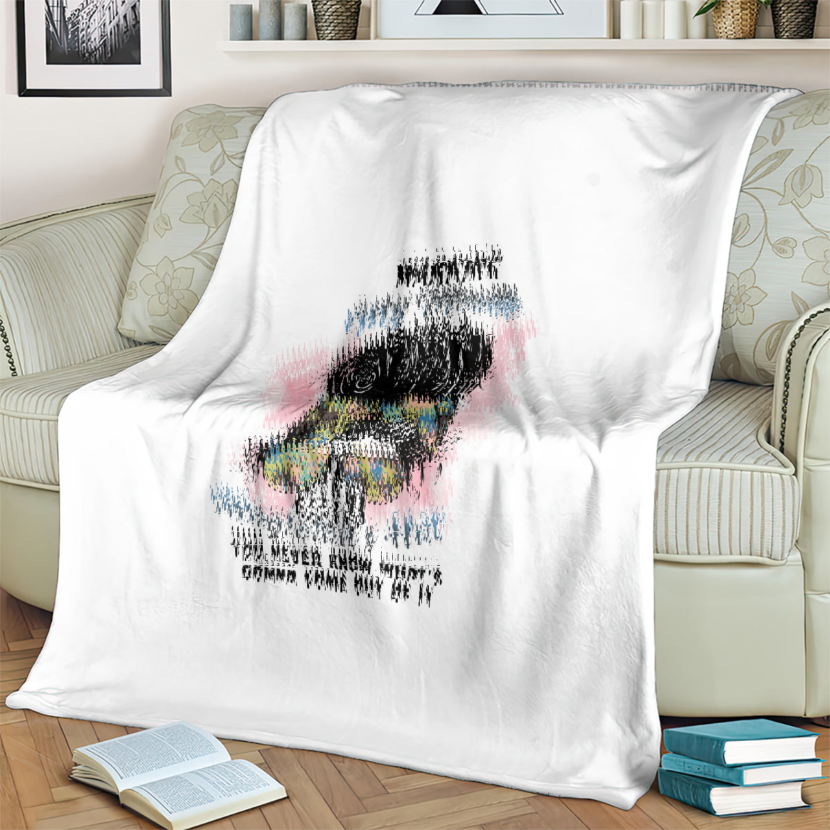 White blanket with central colorful portrait graphic and warning text