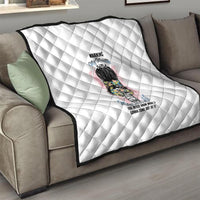 White quilt with diamond pattern and "Warning My Mouth" graphic on sofa
