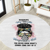 Round gray area rug with central colorful hat-and-skull illustration and warning lettering