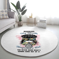 Round gray area rug featuring a colorful hat, skull graphic, and warning slogan
