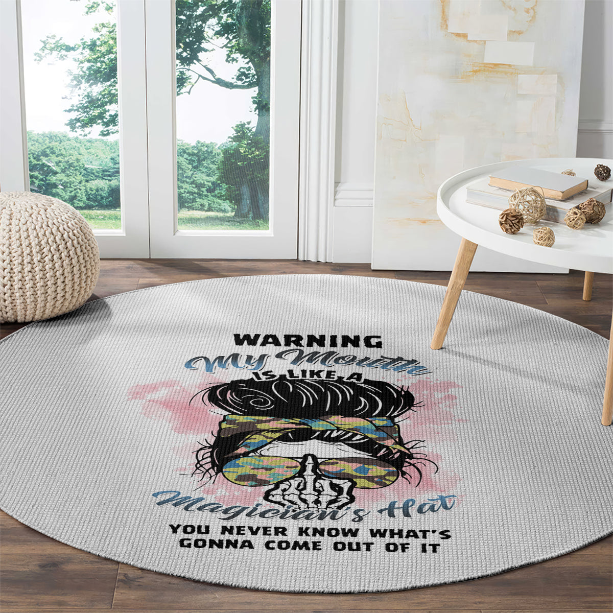 Round gray area rug with colorful hat-and-skull design and bold warning phrase