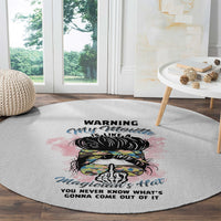 Round gray area rug with colorful hat-and-skull design and bold warning phrase