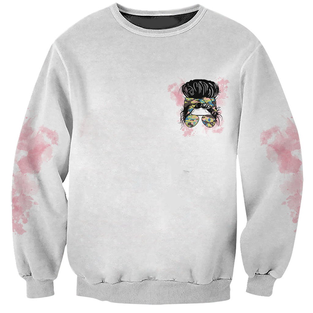 Gray crewneck sweatshirt with small front magician messy bun hat graphic and glasses