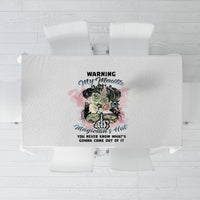 White tablecloth with centered 'WARNING' and floral messy bun graphic