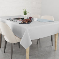 Gray tablecloth on dining table with centered warning graphic panel
