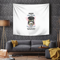 White wall tapestry with central multicolor portrait illustration and small warning text
