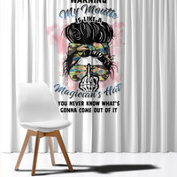 White window curtain with colorful graphic print of a messy-bun magician character