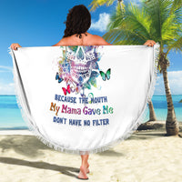 Multicolor sugar skull beach blanket with fringe trim, held open by model