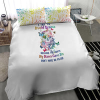 White duvet with colorful sugar skull illustration and matching swirl-pattern pillowcases