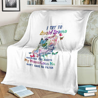 White throw blanket over sofa with colorful sugar skull, butterflies, and quote text