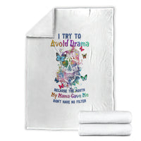 White sugar skull blanket with colorful skull, butterflies, and quote, shown folded