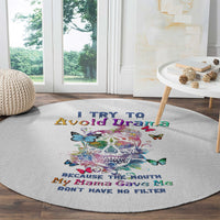 Round white rug with sugar skull and butterfly graphics and multicolor quote text