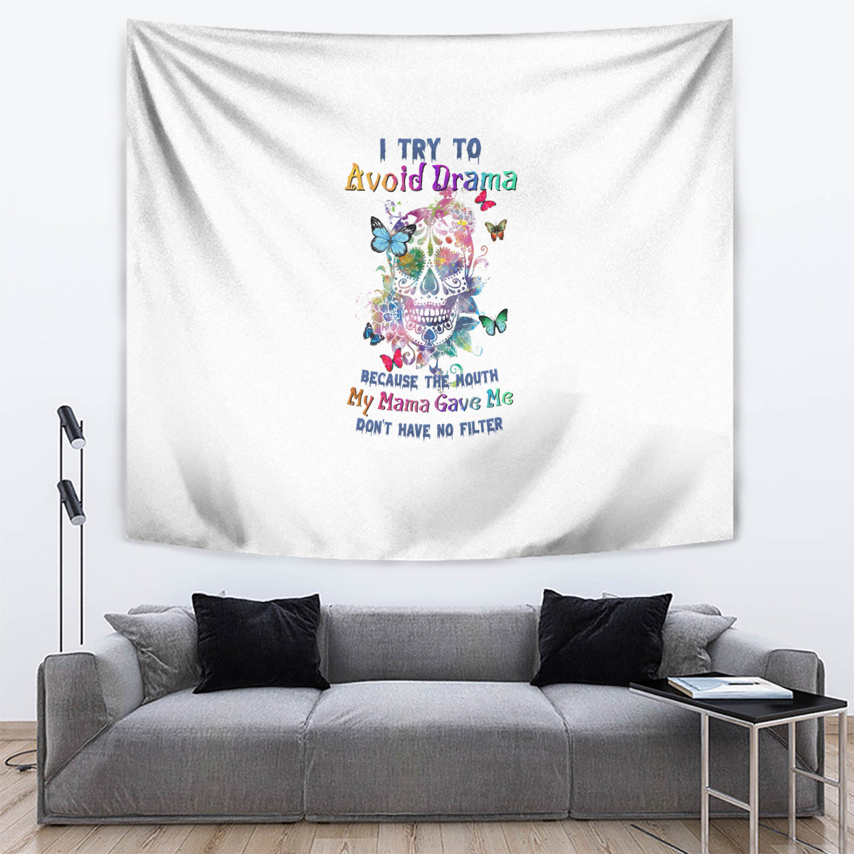 White tapestry wall hanging with colorful sugar skull, butterflies, and motivational quote text