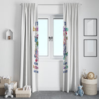 Pair of white curtains with colorful sugar skull print, covering a window center.