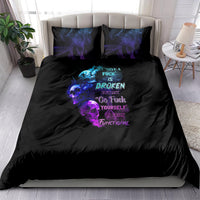 Black bedding set with colorful skull and text graphic, plus two matching pillowcases