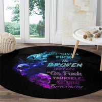 Black round carpet with blue and purple skull graphic and neon-style quote text