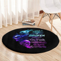 Black round carpet with neon blue and purple skull design and stylized quote text