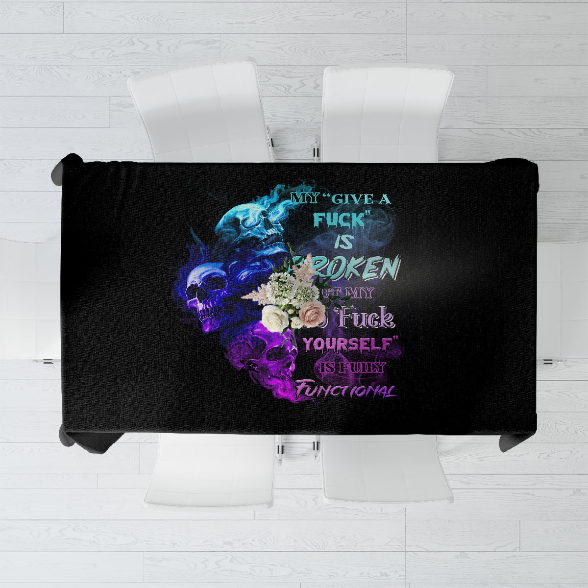 Black tablecloth with colorful skull-and-text graphic panel