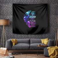 Black wall tapestry with multicolor skull and flame graphic plus word art.