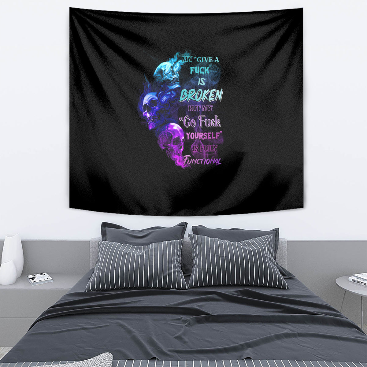Black wall tapestry with multicolor skull, flames, and word art at center.