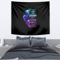 Black wall tapestry with multicolor skull, flames, and word art at center.