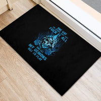 Black rubber doormat with blue skull graphic and bold text design
