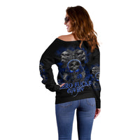 Off-shoulder black sweatshirt with blue skull graphic and 'ZERO FUCKS GIVEN' on back