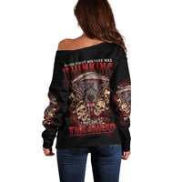 Women’s off-shoulder black sweater with large back graphic and skull art on sleeves