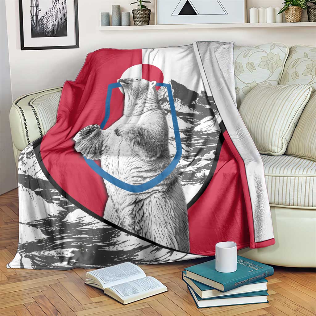 Polar bear graphic blanket with red, white, and gray panels; large bear face and mountains.