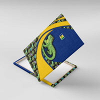 Canvas wall art close-up with green iguana and tropical leaf pattern on blue and yellow