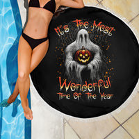 Round Halloween beach blanket, black ghost and jack-o'-lantern graphic, white fringe edge