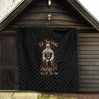 Black quilt hanging on porch wall, diamond quilting and ghost with jack-o-lantern graphic