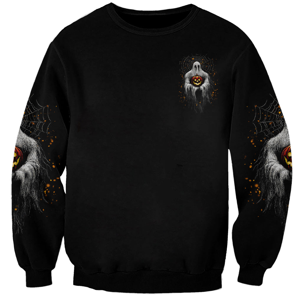 Black unisex Halloween sweatshirt with small ghost and jack-o-lantern graphic