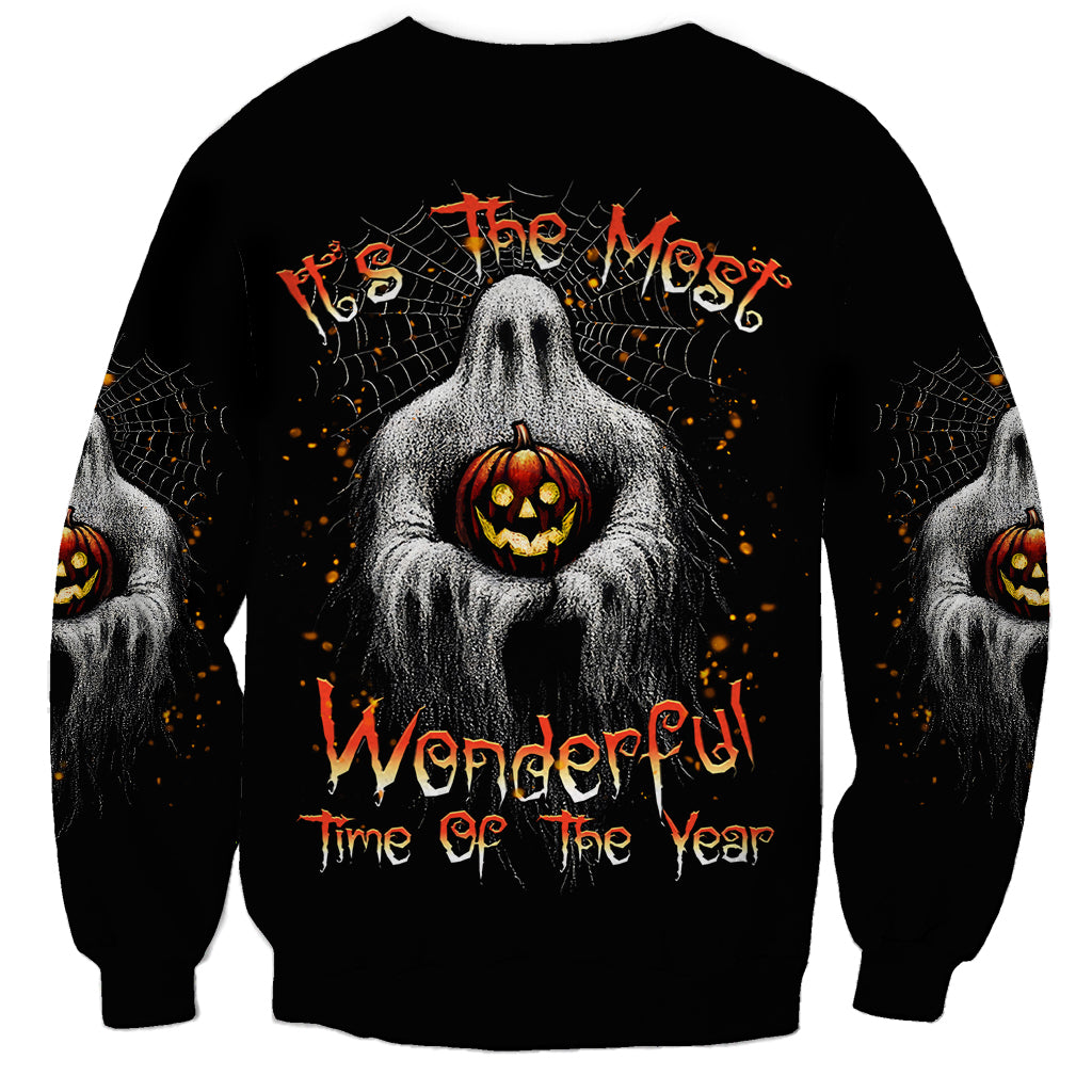 Black unisex Halloween sweatshirt with ghost holding jack-o-lantern, spiderweb text