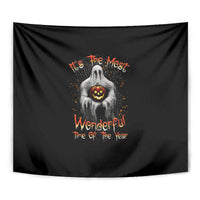 Black Halloween tapestry close-up of a ghost holding a glowing jack-o'-lantern and orange text.