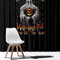 Black Halloween window curtain with jack-o-lantern ghost face and orange lettering.