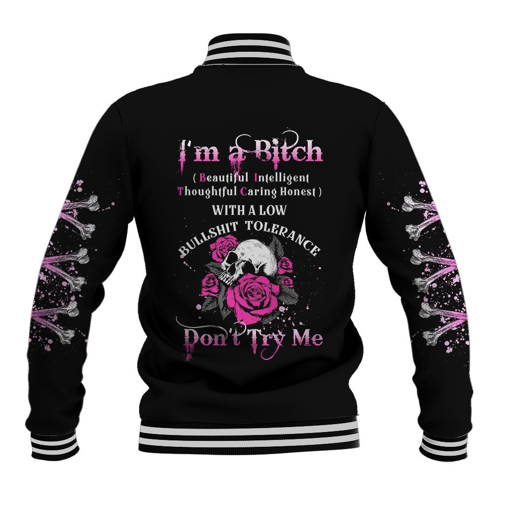Black baseball jacket with rose skull graphic, pink “Don’t Try Me” text, striped collar cuffs