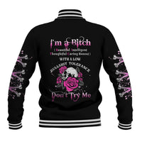 Black baseball jacket with rose skull graphic, pink “Don’t Try Me” text, striped collar cuffs