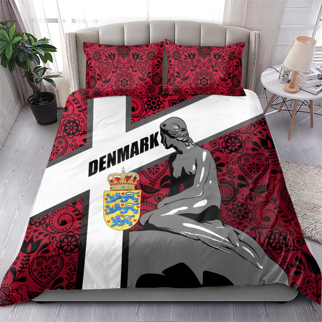 Red bedding set with mermaid graphic, Denmark word, cross stripe, and two matching pillows