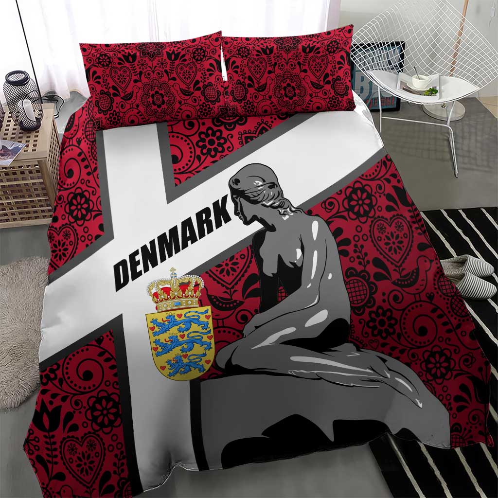 Red bedding set with mermaid artwork, Denmark text across white cross, and two pillows