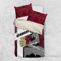 Red and white bedding set with mermaid graphic, Denmark text, and two pillowcases on flat surface