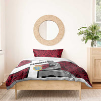 Red Denmark-themed duvet with mermaid graphic and two pillowcases on a wooden bed