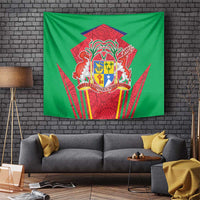 Green tapestry with red and gold Mauritius coat of arms crest and traditional patterns