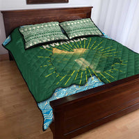 Green quilt bed set with Rwanda map and yellow rays, blue geometric border, two matching pillows